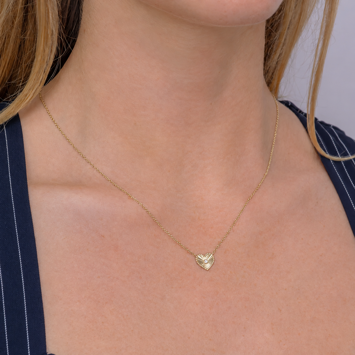 14K Gold Diamond Ribbed Heart Necklace Worn on Neck