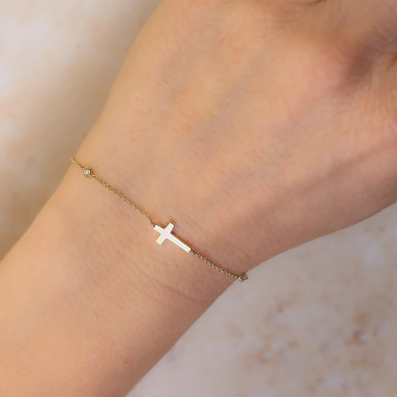 14K Gold Diamond Bezel Cross Bracelet Worn on Wrist