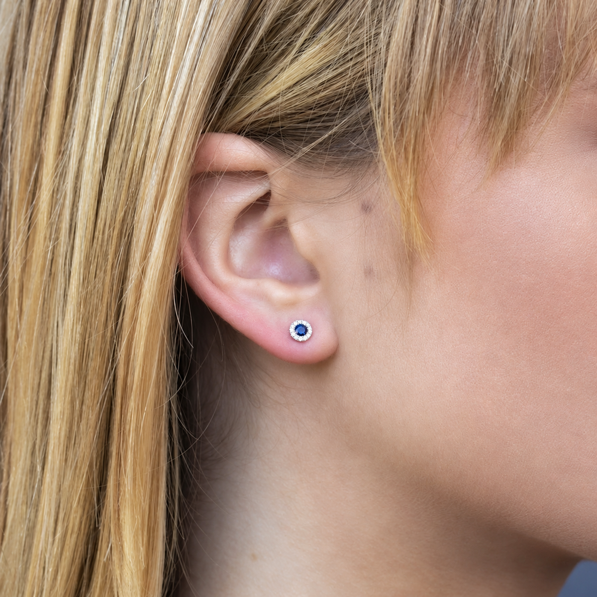14K Gold Sapphire Halo Stud Earrings Worn on Ear