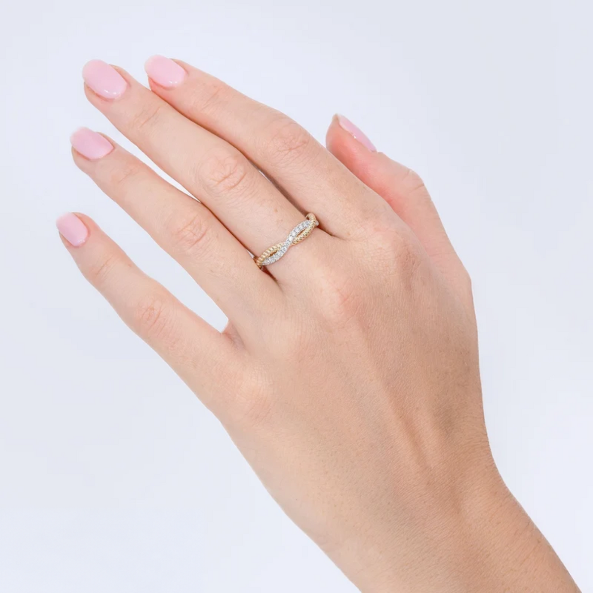14K Gold Diamond Twisted Ring Worn on Finger